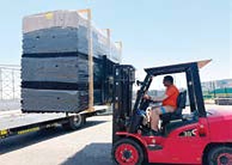 Palletised Marshall-Tufflex conduit being loaded for despatch at the KEZAD plant